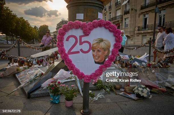 Flowers, photographs and messages to Diana, Princess of Wales, are left at the Liberty Flame above the Pont de l'Alma, the unofficial memorial to...