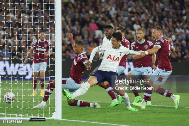 Thilo Kehrer of West Ham United concedes an own goal whilst under pressure from Son Heung-Min of Tottenham Hotspur during the Premier League match...