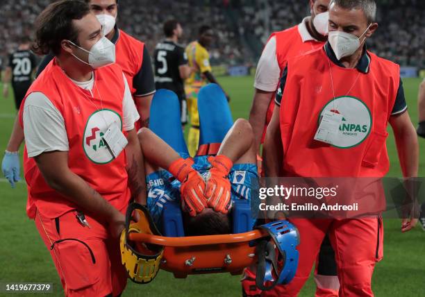 Wojciech Szczesny of Juventus is helped from the pitch after sustaining an injury during the Serie A match between Juventus and Spezia Calcio at...