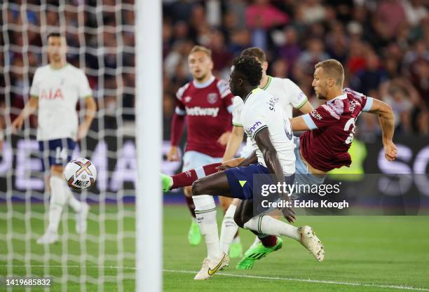 Tomas Soucek of West Ham United scores their side's first goal whilst under pressure from Davinson Sanchez of Tottenham Hotspur during the Premier...