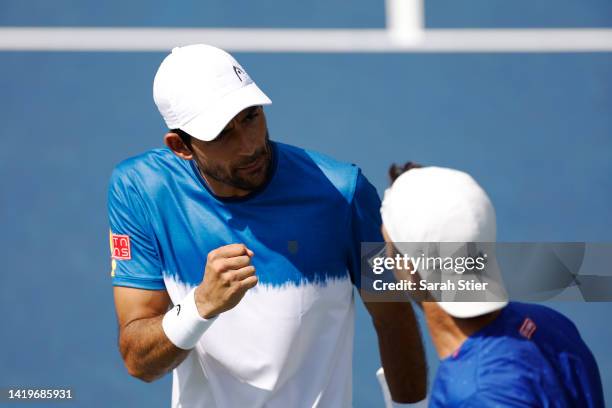 Marcelo Arevalo of El Salvador and Jean-Julien Rojer of Netherlands react to a point against John Peers of Australia and Alexi Popyrin of Australia...