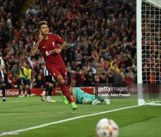 Roberto Firmino of Liverpool celebrates after scoring the first goal during the Premier League match between Liverpool FC and Newcastle United at...