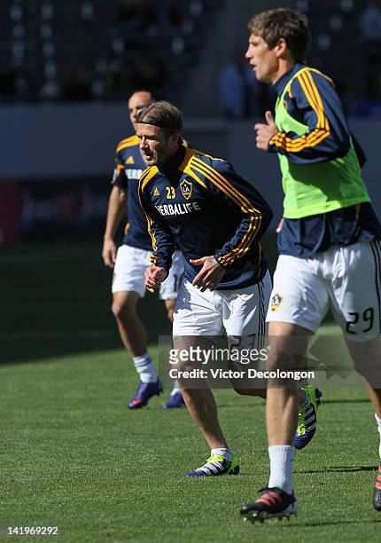 Landon Donovan, David Beckham and Andrew Boyens of the Los Angeles Galaxy warm up during prior to their MLS match against D.C. United at The Home...