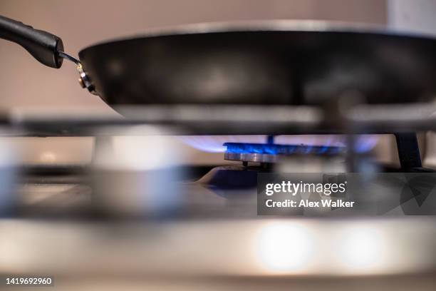 flames on gas stove burner - gas stove cooking stock pictures, royalty-free photos & images