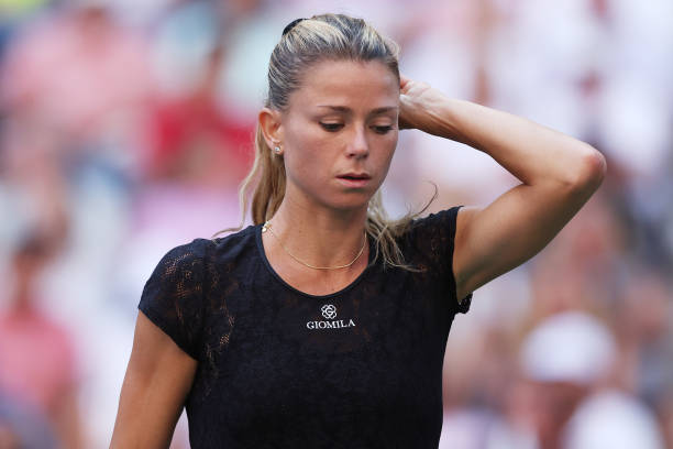 Camila Giorgi of Italy reacts after her loss to Madison Keys of the United States in their Women's Singles Second Round match on Day Three of the...