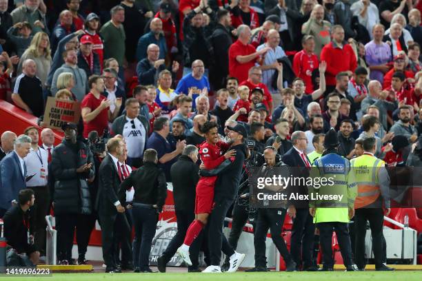 Fabio Carvalho of Liverpool celebrates scoring their side's second goal with Juergen Klopp, Manager of Liverpool, during the Premier League match...