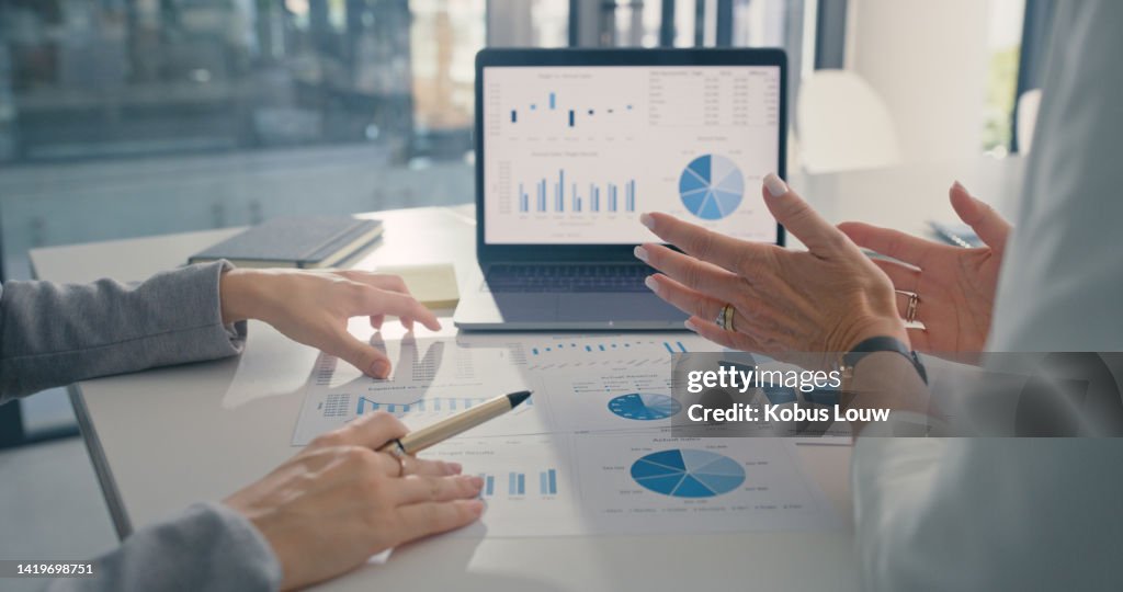 Data analysis, marketing strategy or statistics by business development leaders planning company growth. Hands of finance managers in a meeting talking about financial performance in an office
