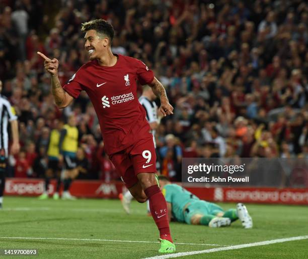 Roberto Firmino of Liverpool celebrates after scoring the first goal during the Premier League match between Liverpool FC and Newcastle United at...