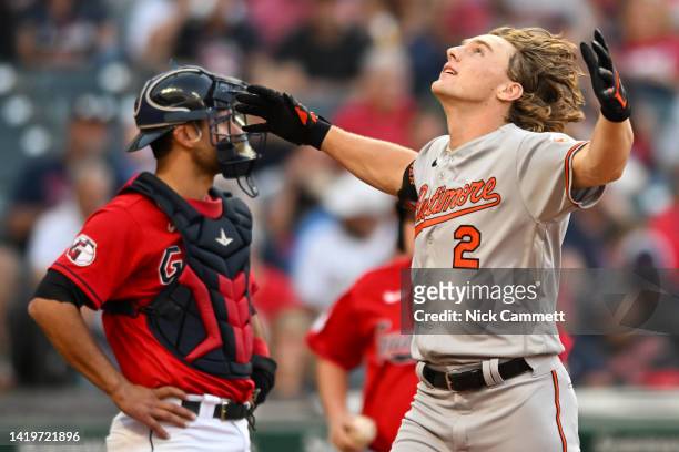 Gunnar Henderson of the Baltimore Orioles celebrates hitting a solo home run off Triston McKenzie of the Cleveland Guardians for his first career hit...