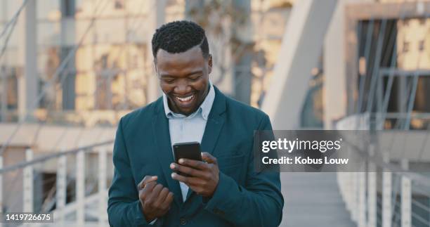 happy, excited and success while reading phone message with business man celebrating being a winner and cheering for investment growth outside. lucky entrepreneur getting good news using fintech app - rewards program stock pictures, royalty-free photos & images