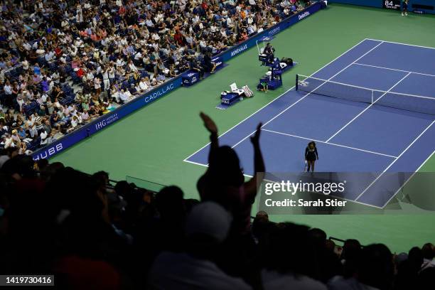 Fans cheer as Serena Williams of the United States wins the first set against Anett Kontaveit of Estonia in their Women's Singles Second Round match...