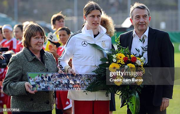Kerstin Garefrekes is seen with Hannelore Ratzeburg and DFB president Wolfgang Niersbach during the Birgit Prinz farewell match between Germany and...
