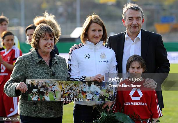 Sonja Fuss is seen with Hannelore Ratzeburg and DFB president Wolfgang Niersbach during the Birgit Prinz farewell match between Germany and 1. FFC...