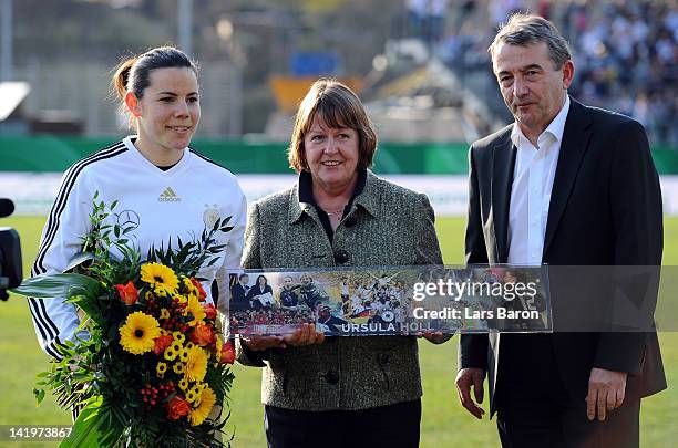 Goalkeeper Ursula Holl is seen with Hannelore Ratzeburg and DFB president Wolfgang Niersbach during the Birgit Prinz farewell match between Germany...