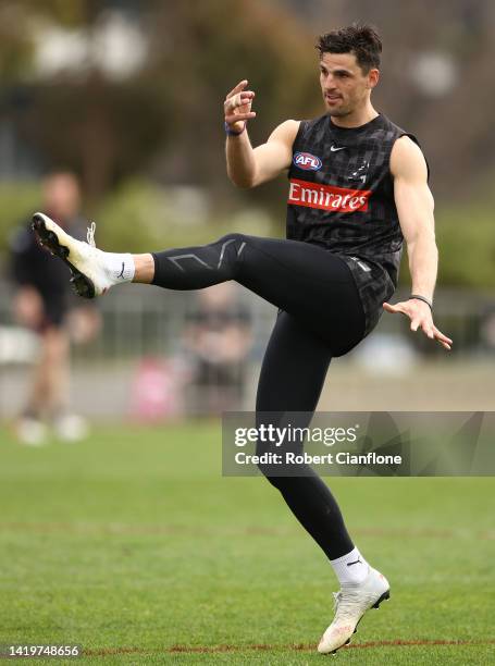 Scott Pendlebury of the Magpies kicks the ball during a Collingwood Magpies AFL training session at Olympic Park Oval on September 01, 2022 in...