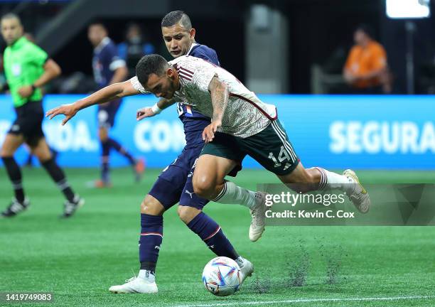 Luis Chavez of Mexico is fouled by Derlis Gonzalez of Paraguay during the first half of an international friendly between Mexico and Paraguay at...