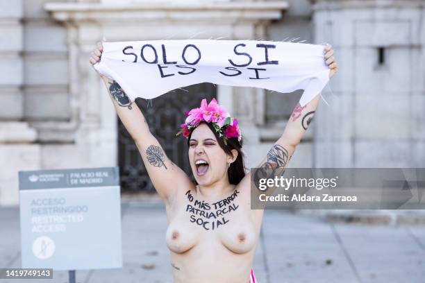 Member of the women's rights organization Femen protests with the slogan "No more social patriarchal terror" written on her chest in front of the...