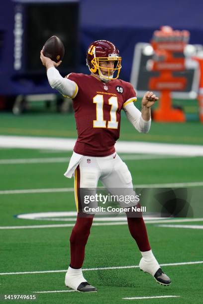 Alex Smith of the Washington Football Team throws the ball prior to an NFL game against the Dallas Cowboys at AT&T Stadium on November 26, 2020 in...