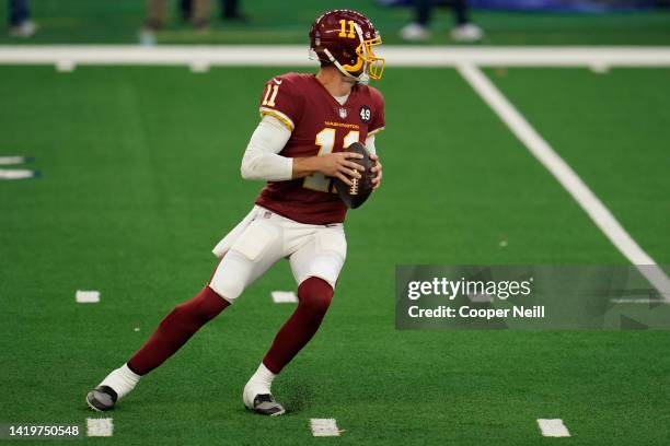 Alex Smith of the Washington Football Team drops back to pass during an NFL game against the Dallas Cowboys at AT&T Stadium on November 26, 2020 in...