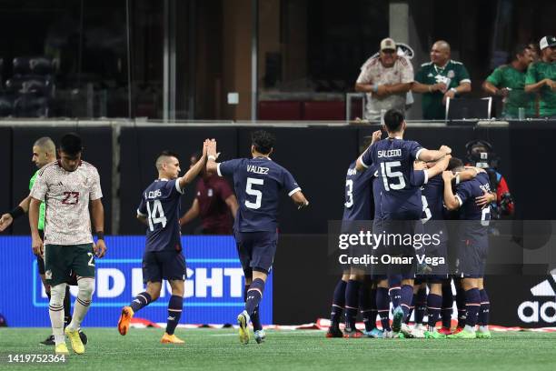 Derlis Gonzalez of Paraguay celebrates with his teammates after scoring the first goal of his team during the friendly match between Mexico and...