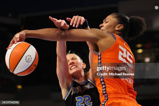 Alyssa Thomas of the Connecticut Sun and Courtney Vandersloot of the Chicago Sky battle for a rebound during the second half in Game Two of the 2022...