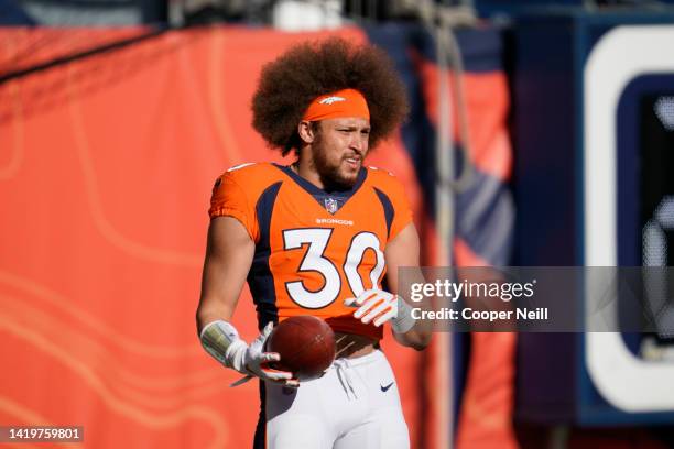 Phillip Lindsay of the Denver Broncos holds the ball prior to an NFL game against the New Orleans Saints on November 29, 2020 in Denver, Colorado.