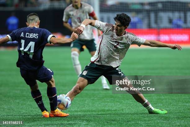 Kevin Alvarez of Mexico challenges Andres Cubas of Paraguay during the second half of an international friendly between Mexico and Paraguay at...