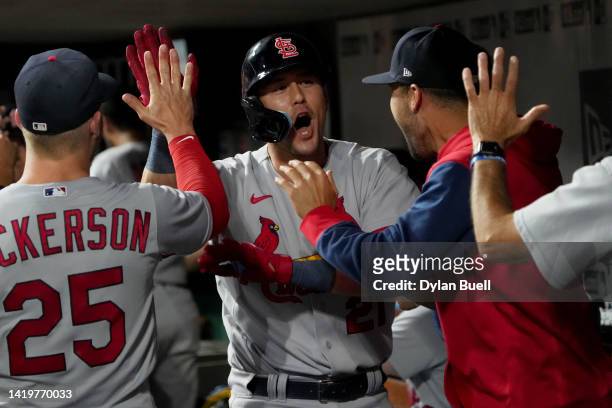 Lars Nootbaar of the St. Louis Cardinals celebrates with teammates after hitting a home run in the 13th inning against the Cincinnati Reds at Great...
