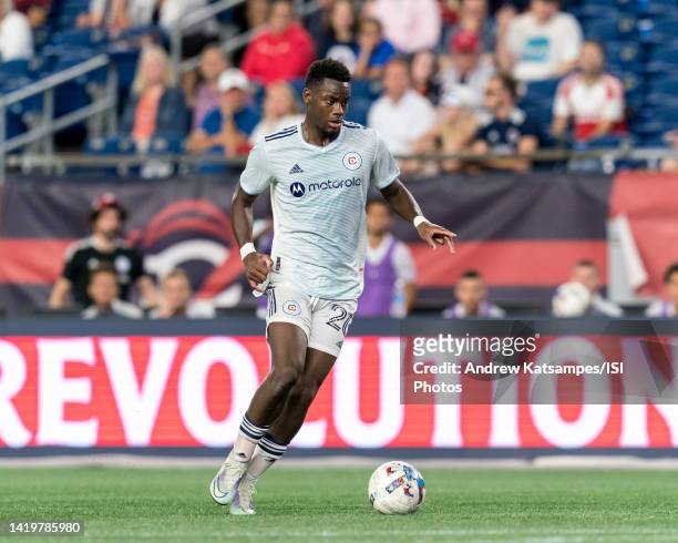 Jhon Duran of Chicago Fire FC brings the ball forward during a game between Chicago Fire FC and New England Revolution at Gillette Stadium on August...