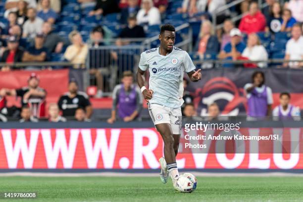 Jhon Duran of Chicago Fire FC brings the ball forward during a game between Chicago Fire FC and New England Revolution at Gillette Stadium on August...