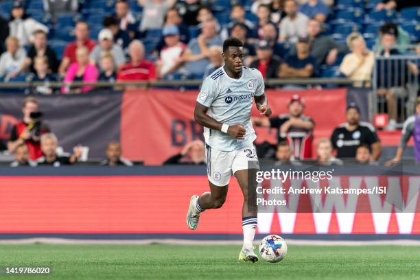 Jhon Duran of Chicago Fire FC brings the ball forward during a game between Chicago Fire FC and New England Revolution at Gillette Stadium on August...