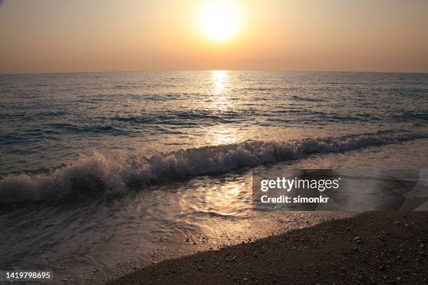 sunset on egremni beach - egremni stock pictures, royalty-free photos & images
