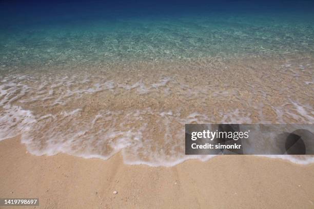 view of wave on egremni beach - egremni stock pictures, royalty-free photos & images