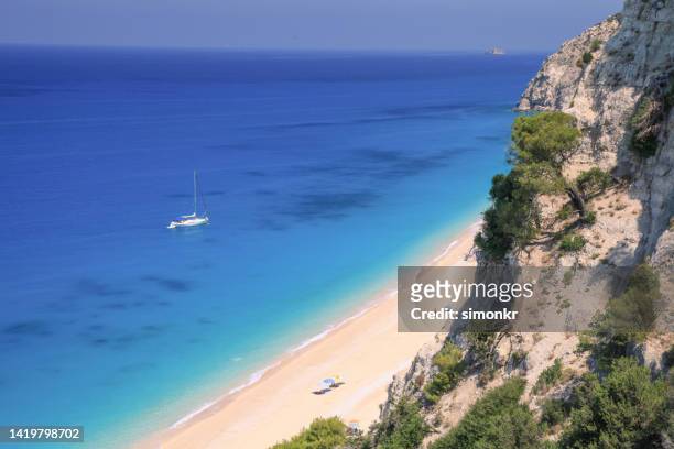 view of sandy egremni beach - levkas stock pictures, royalty-free photos & images