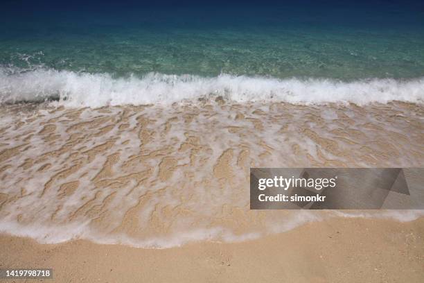 view of waves on egremni beach - egremni stock pictures, royalty-free photos & images
