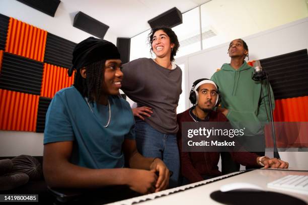 portrait of musicians working in recording studio - rap background stock pictures, royalty-free photos & images