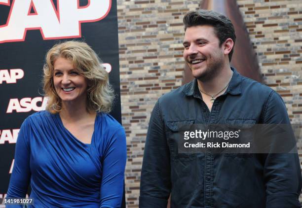ShopKeeper Management's Marion Kraft and Singer/Songwriter Chris Young attend the Chris Young party at the CMA Office on March 27, 2012 in Nashville,...