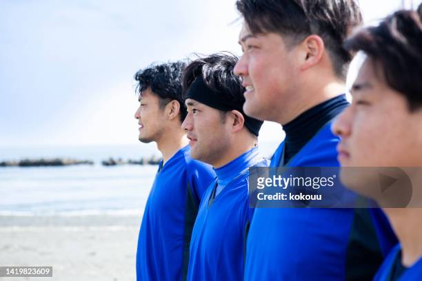 beach footballers lining up before a match - defense player bildbanksfoton och bilder
