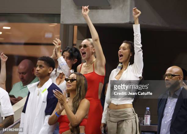 Gigi Hadid, Bella Hadid, below La La Anthony celebrate the victory of Serena Williams during Day 3 of the US Open 2022, 4th Grand Slam of the season,...