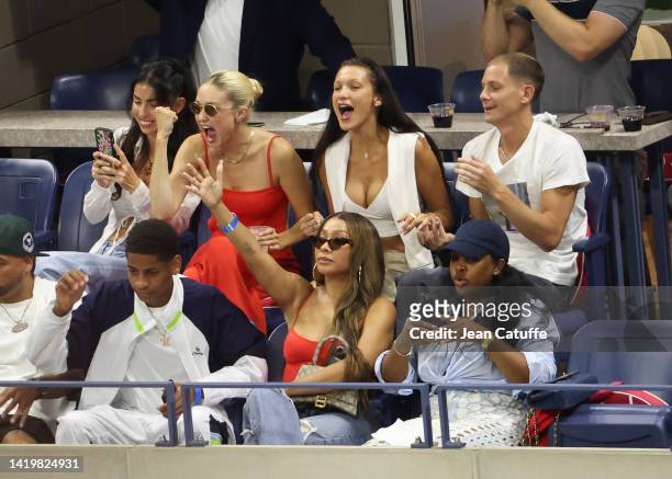 Leah McCarthy, Gigi Hadid, Bella Hadid and Marc Kalman, below La La Anthony and her son Kiyan Carmelo Anthony attend the victory of Serena Williams...