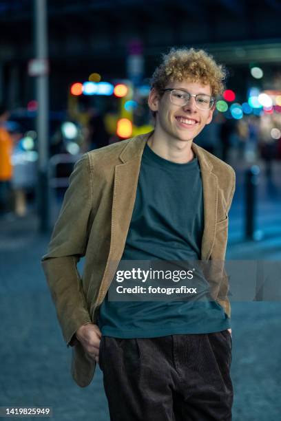 laughing young man in front of urban background - dorks stock pictures, royalty-free photos & images