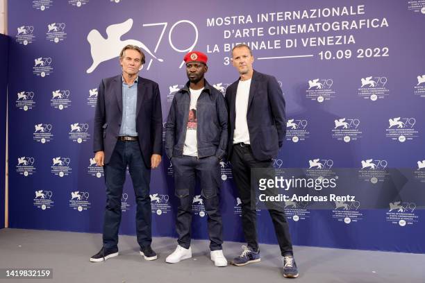 Christopher Sharp, Bobi Wine and John Battsek attend the photocall for "Bobi Wine: Ghetto President" at the 79th Venice International Film Festival...