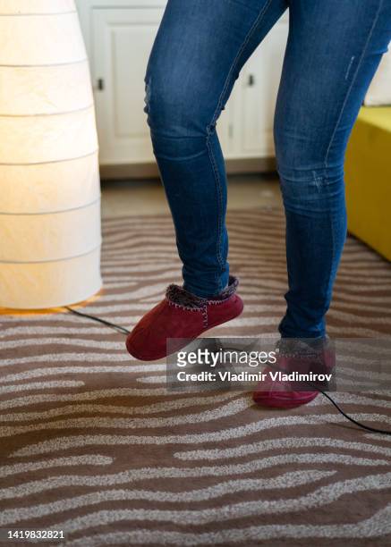 woman legs stumbling with an electrical cord - stumble stock pictures, royalty-free photos & images