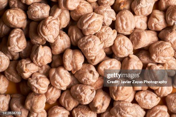 chick peas full frame shot - chickpea stock pictures, royalty-free photos & images