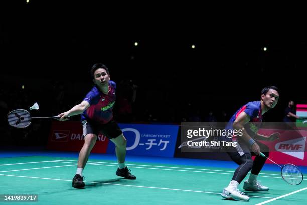 Hendra Setiawan and Mohammad Ahsan of Indonesia compete in the Men's Doubles Second Round match against Liang Weikeng and Wang Chang of China during...
