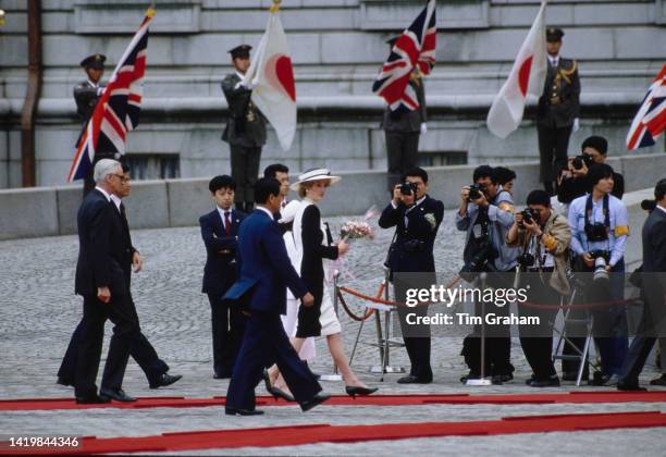 Princess Diana being walked to the Akasaka Palace in Tokyo, Japan, May 1986.