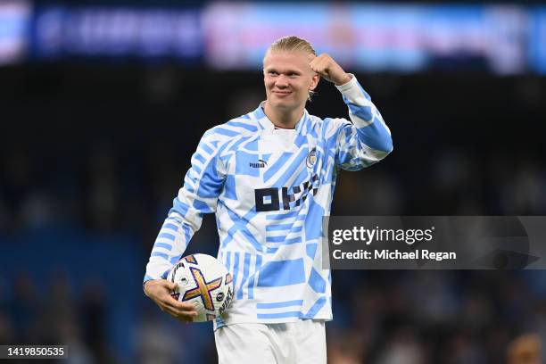 Erling Haaland of Manchester City celebrates with the match ball after scoring a hat-trick during the Premier League match between Manchester City...