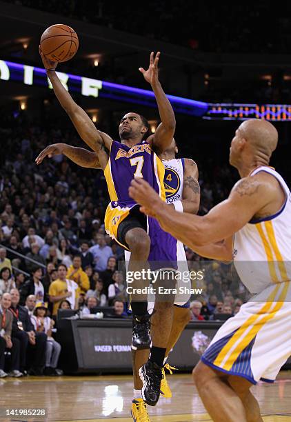 Ramon Sessions of the Los Angeles Lakers drives to the basket during their game against the Golden State Warriors at Oracle Arena on March 27, 2012...