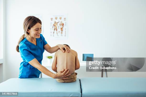 manual muscles tests and posture checking - scoliosis stock pictures, royalty-free photos & images