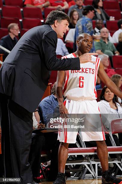 Earl Boykins of the Houston Rockets speaks to Head Coach Kevin McHale of the Houston Rockets during the game between the Houston Rockets and the...